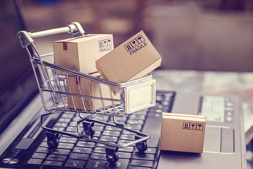 Boxes in a trolley on a laptop keyboard. Ideas about online shopping, online shopping is a form of electronic commerce that allows consumers to directly buy goods from a seller over the internet.